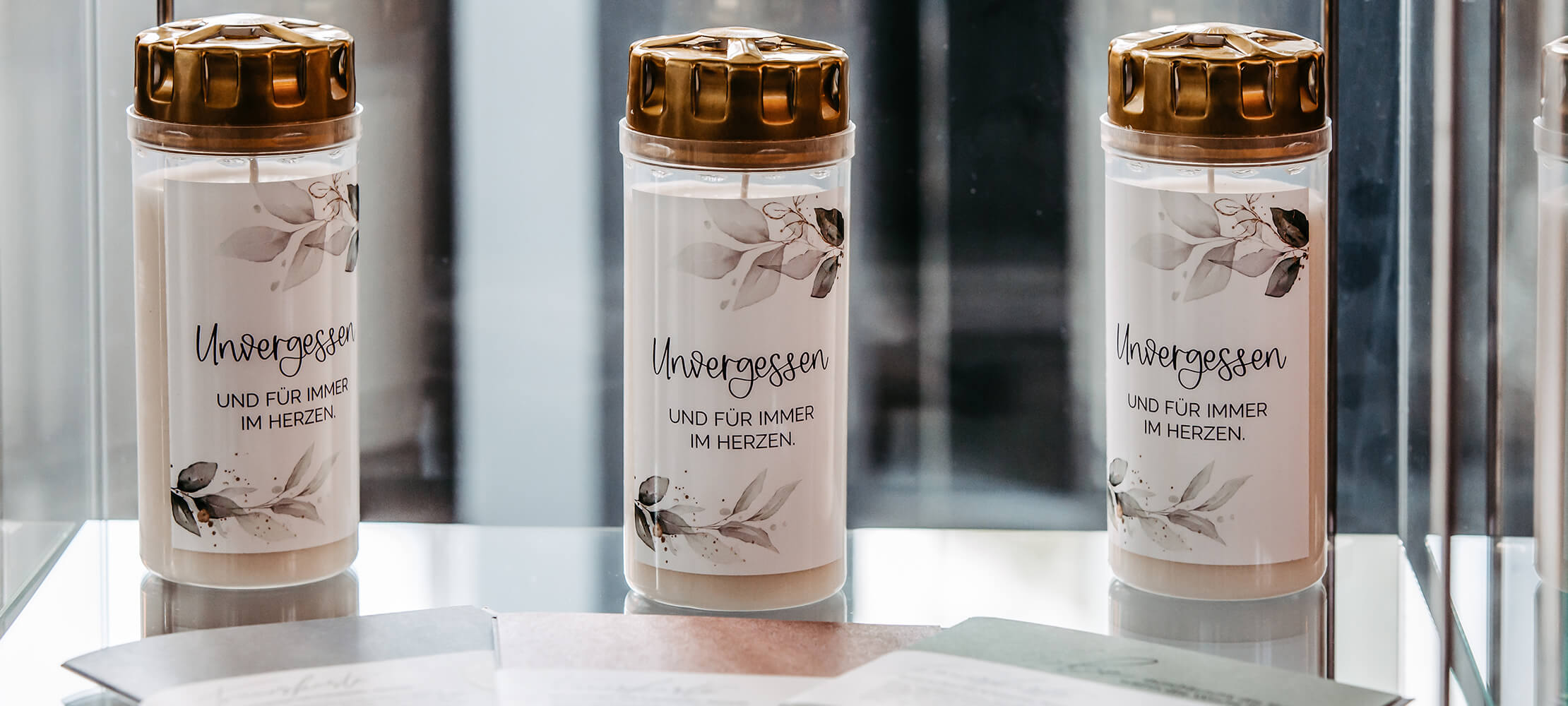 Bestattungshaus Frank | Ölkerzen mit Schriftzug "Unvergessen und für immer im Herzen"